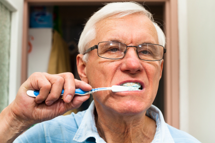 Senior man brushing his teeth