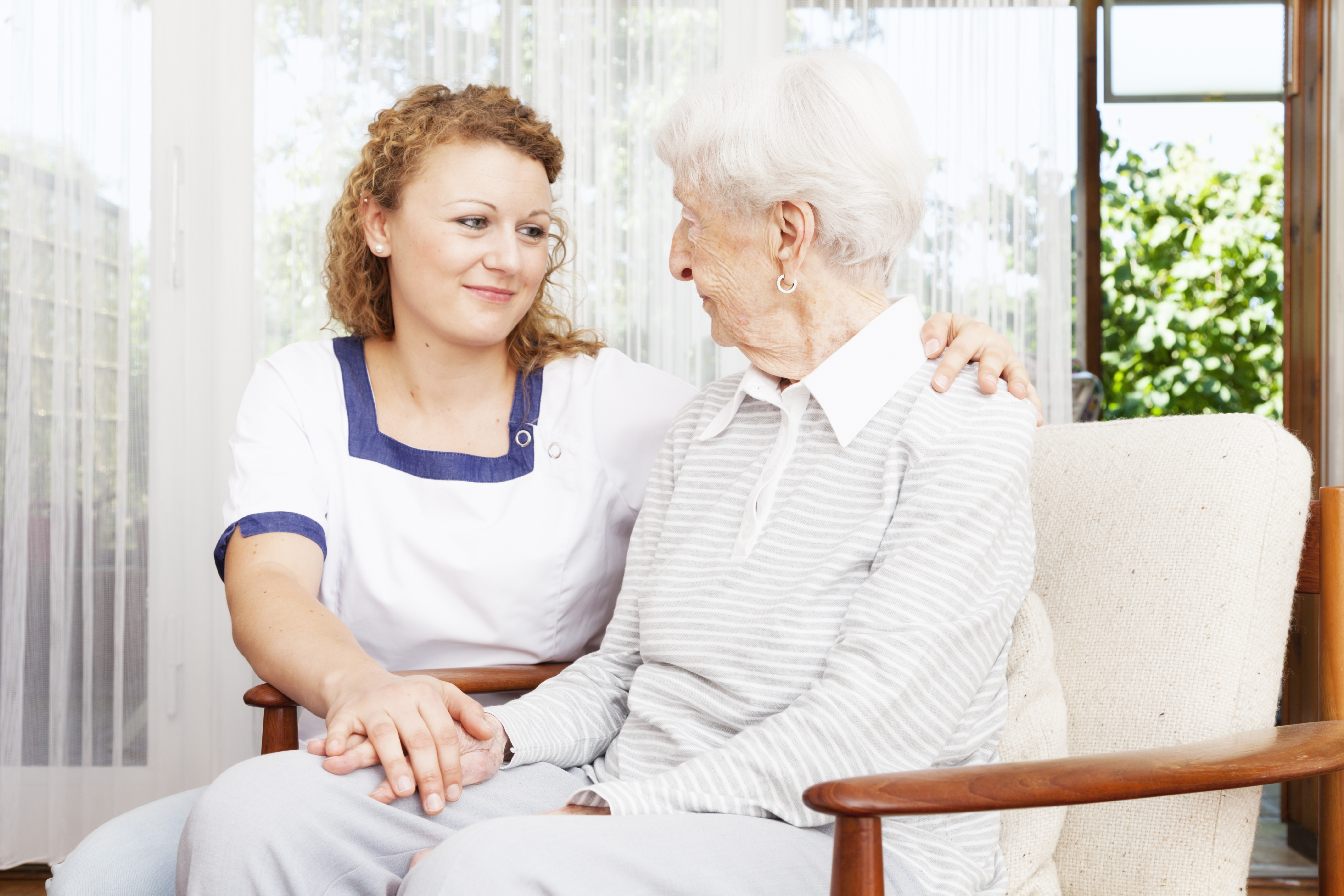 senior woman and caregiver togetherness