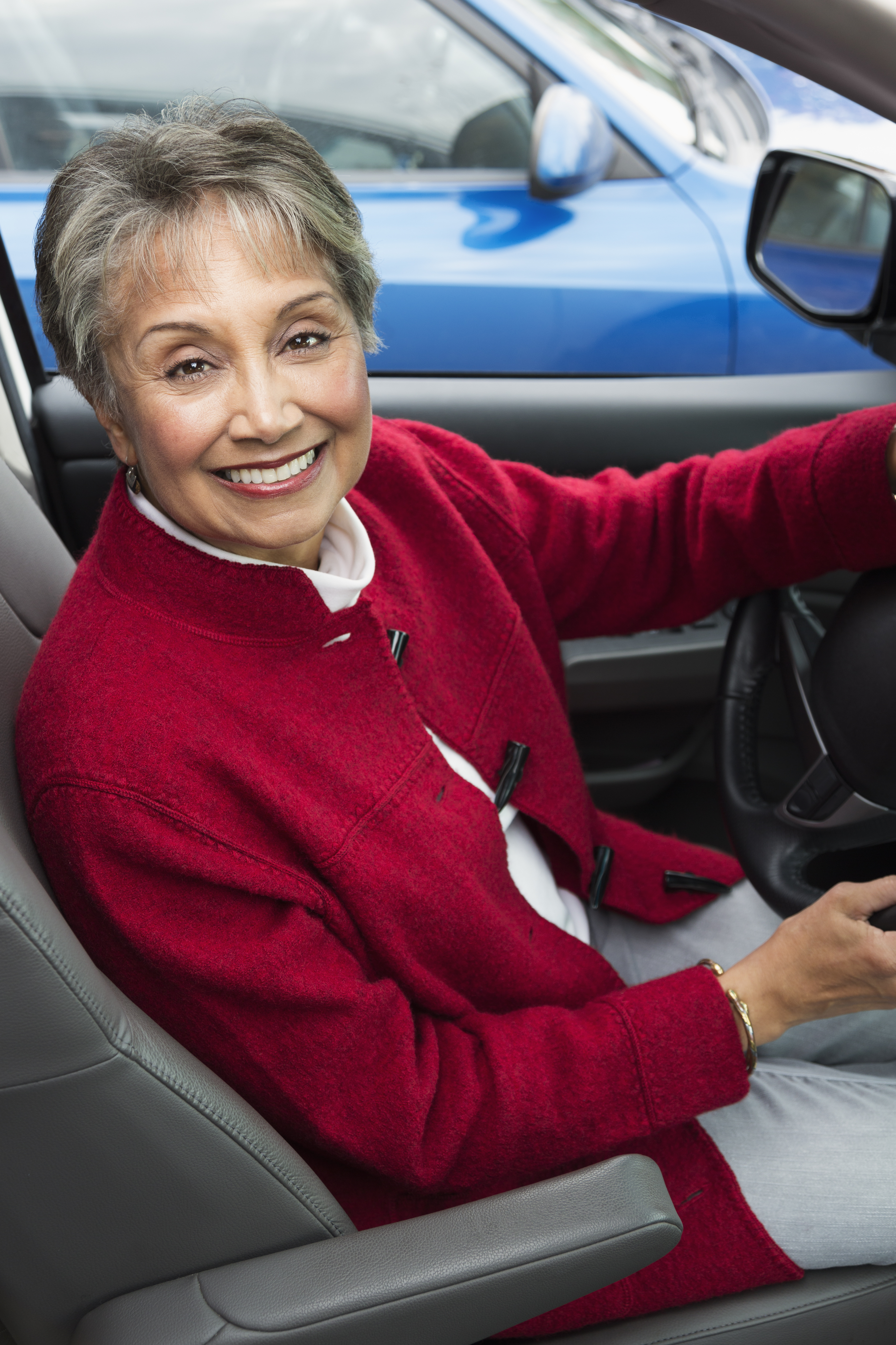 Mixed race woman driving in car