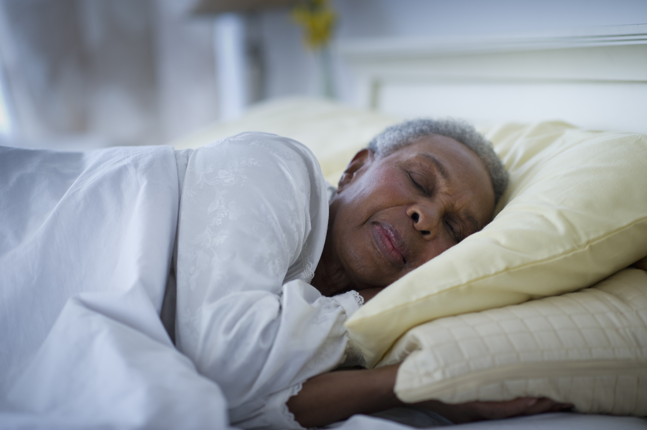 Black woman sleeping in bed