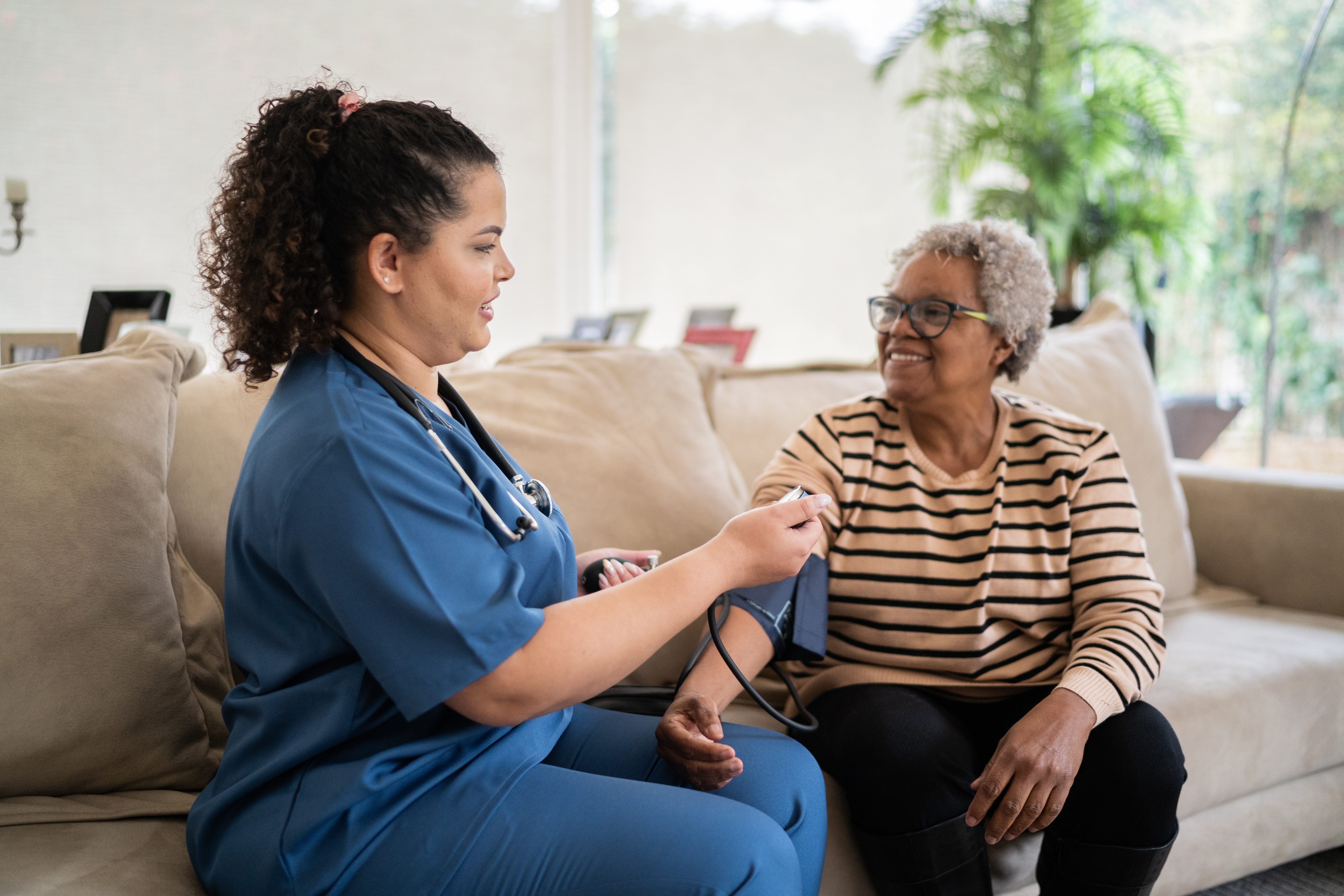 Nurse taking a patient's blood pressure