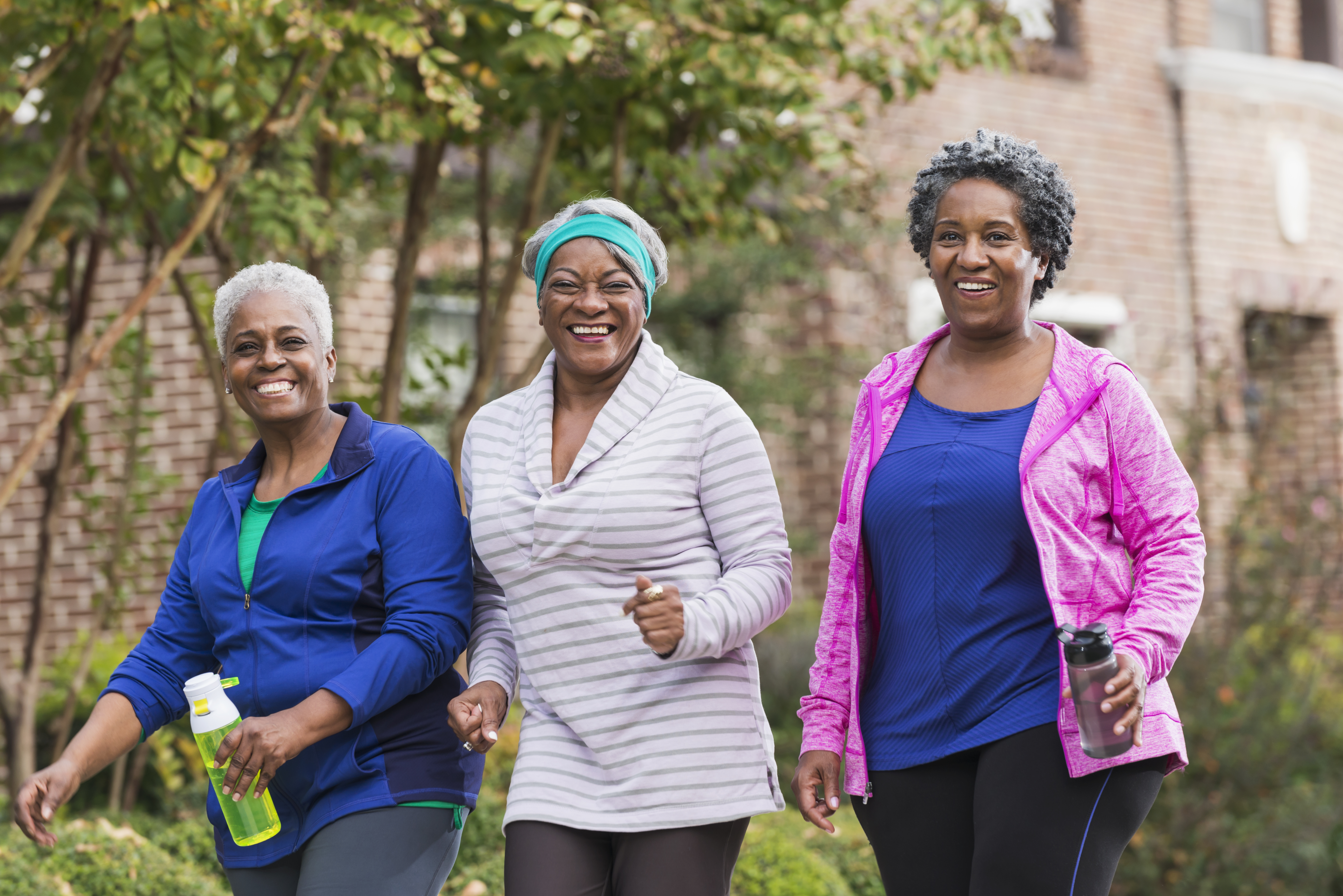 Three senior black women exercising together