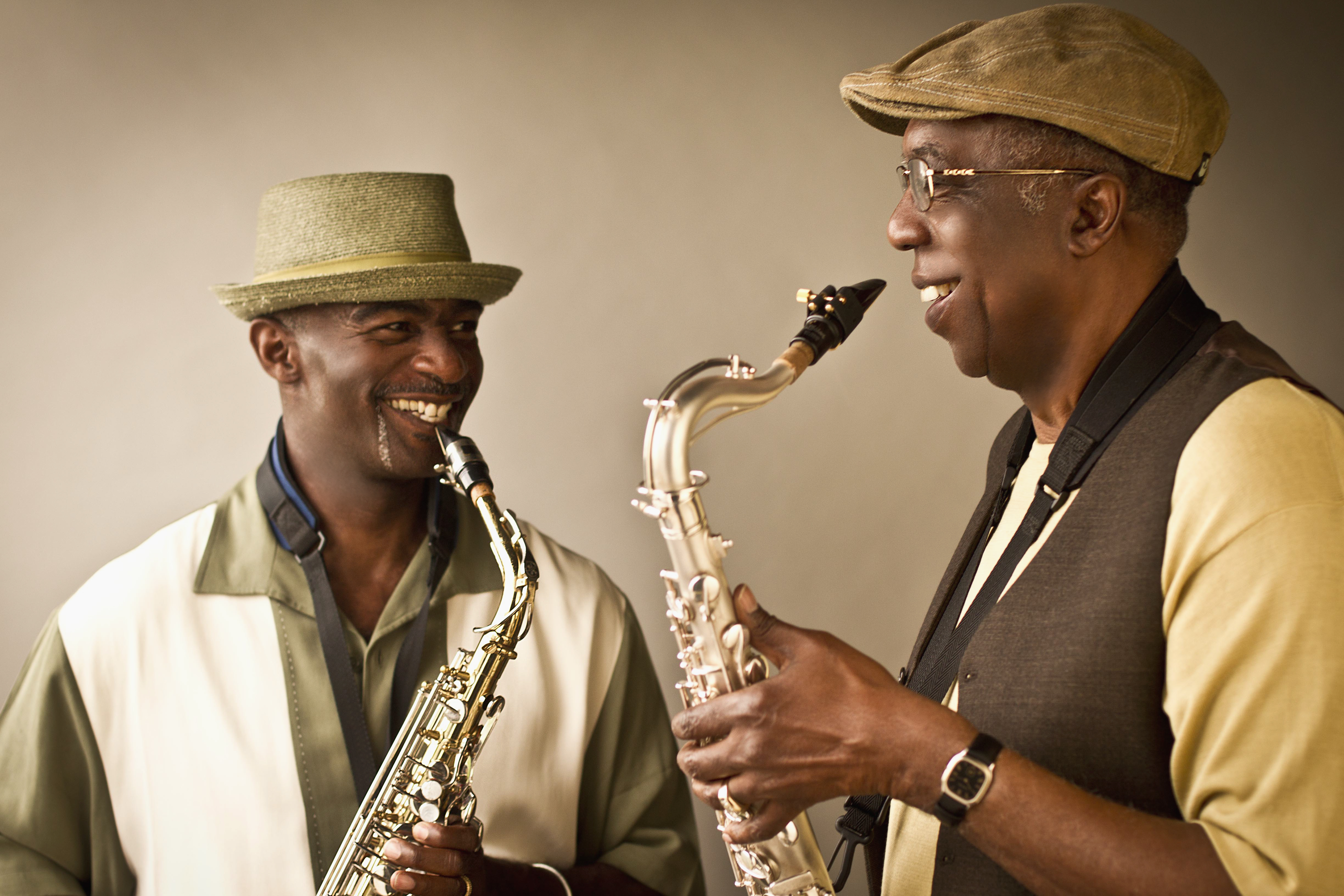 African American musicians playing saxophones together