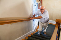 Elderly man climbing stairs_ Kali Nine LLC_sized for ET