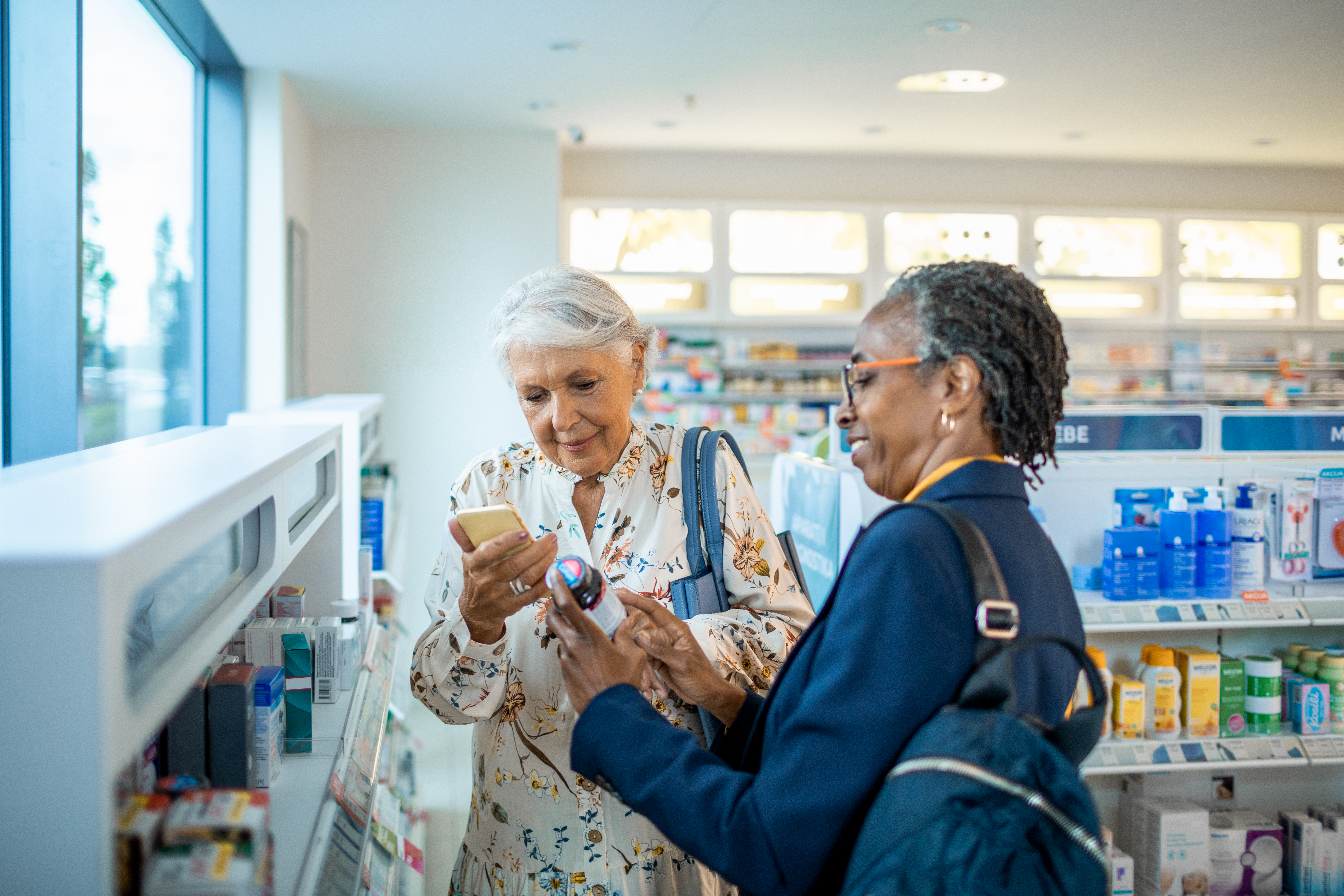 Senior friends browsing the shelves in a pharmacy