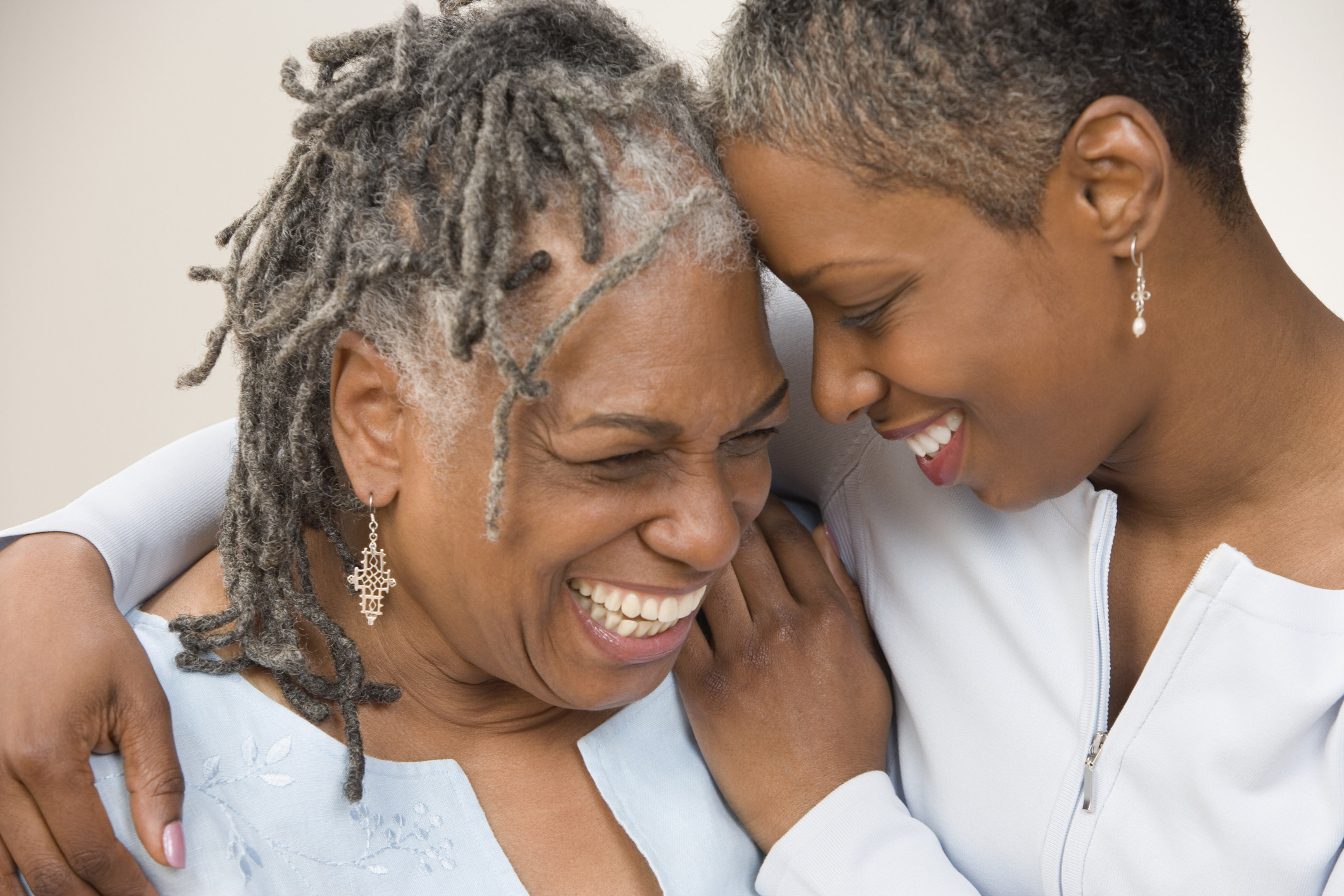 Grown daughter hugging mother