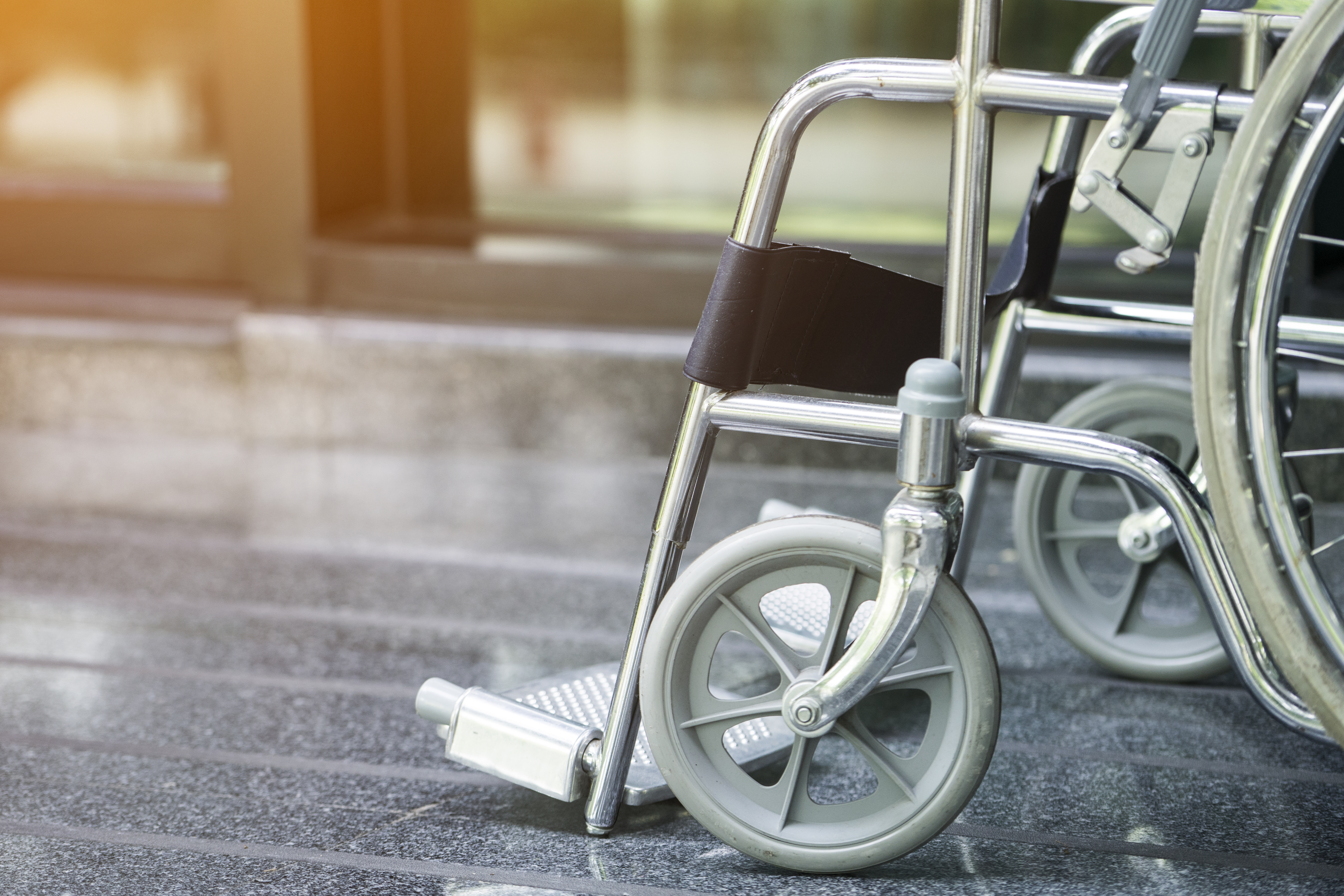 Empty wheelchair parked in hospital