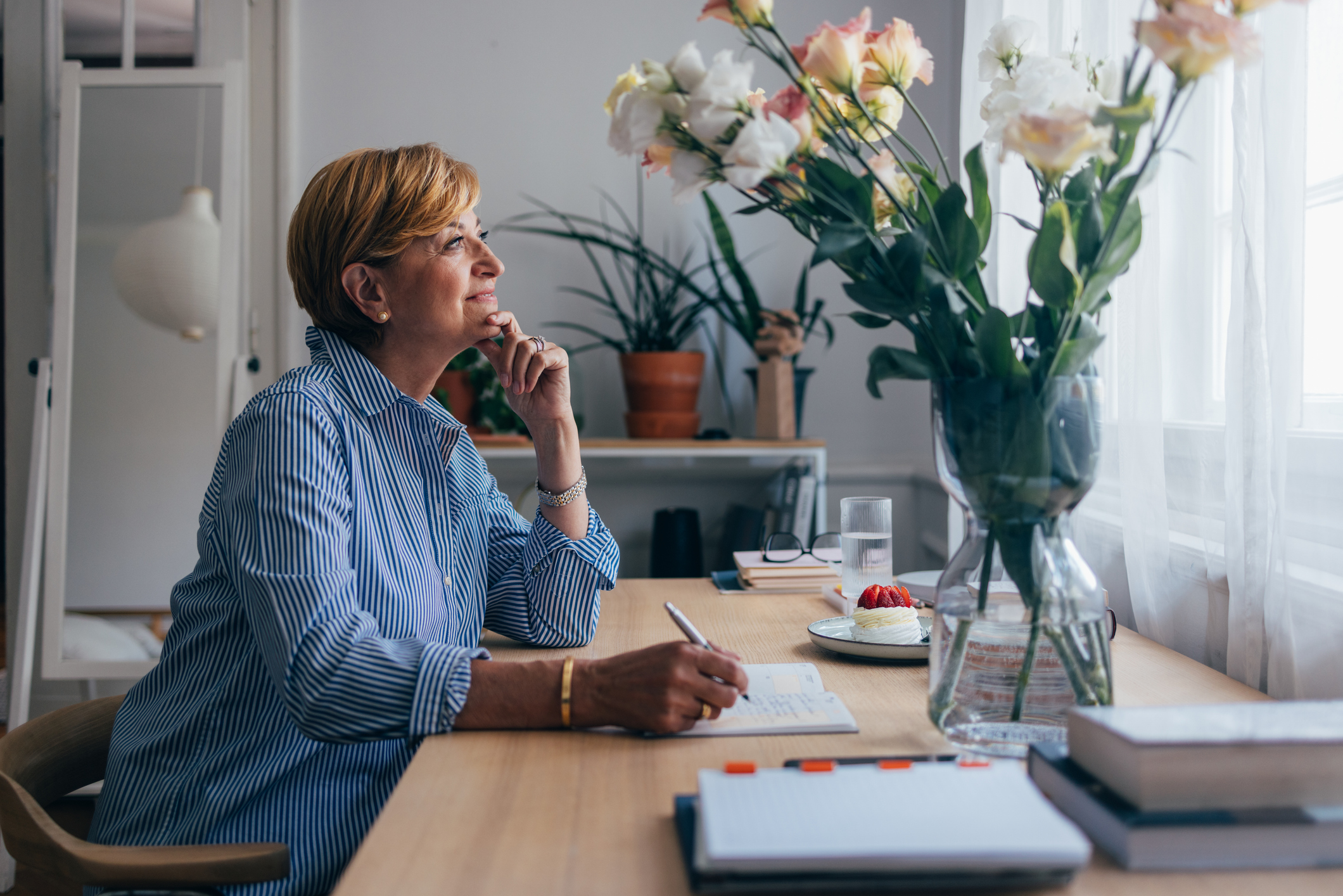 Beautiful Senior Woman Writing in Her Diary