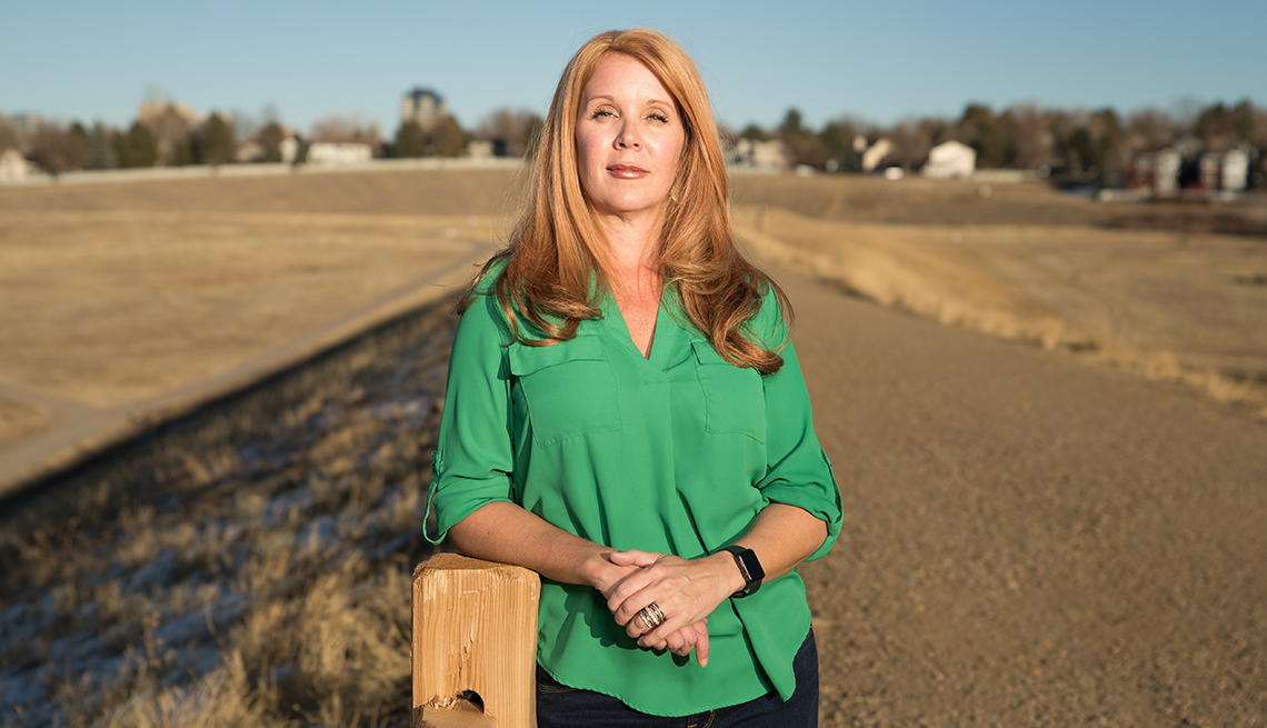 A woman stands outside