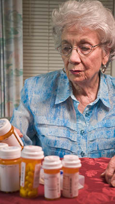 senior woman and prescription medication