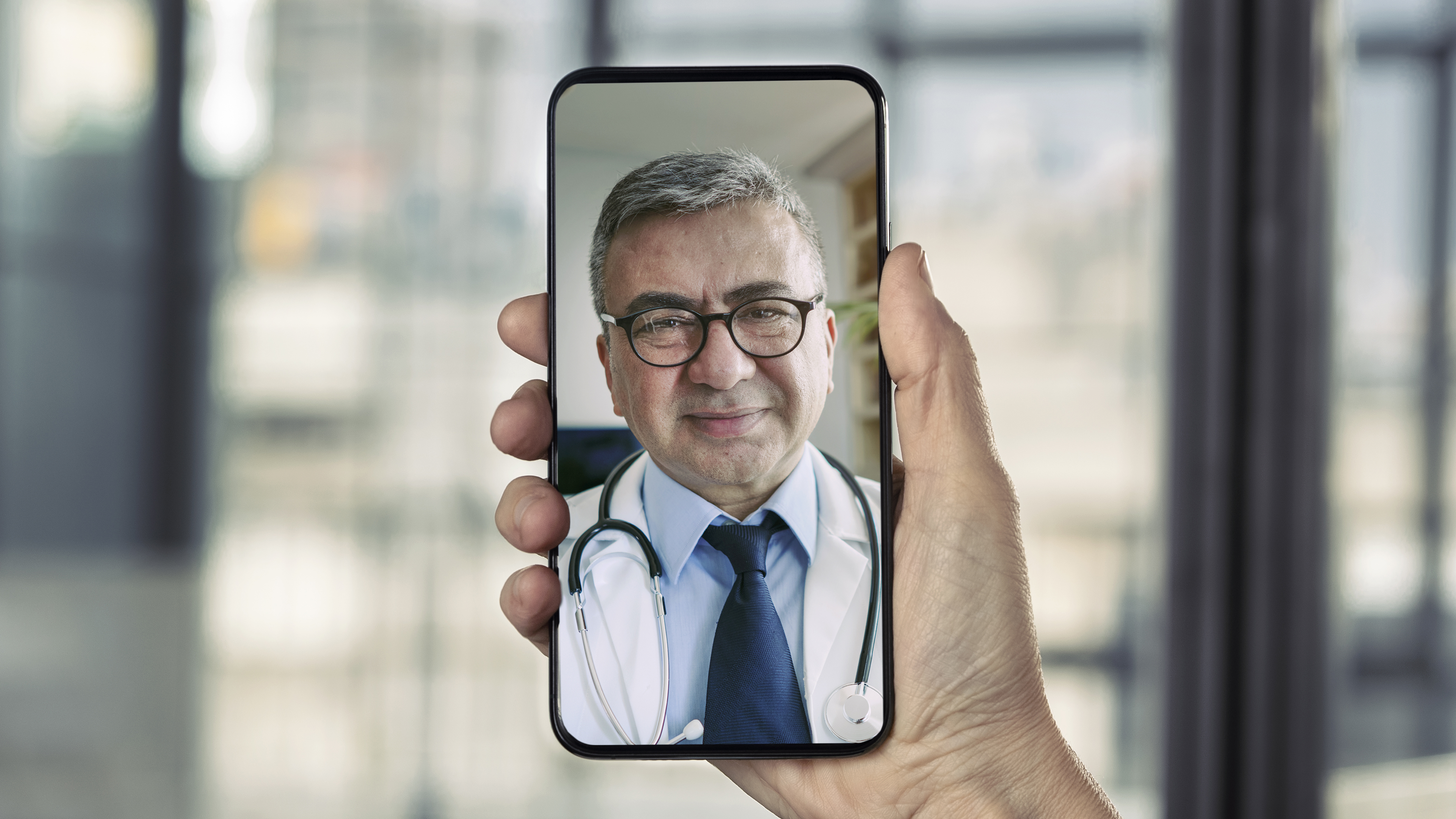 Doctor talking on mobile phone