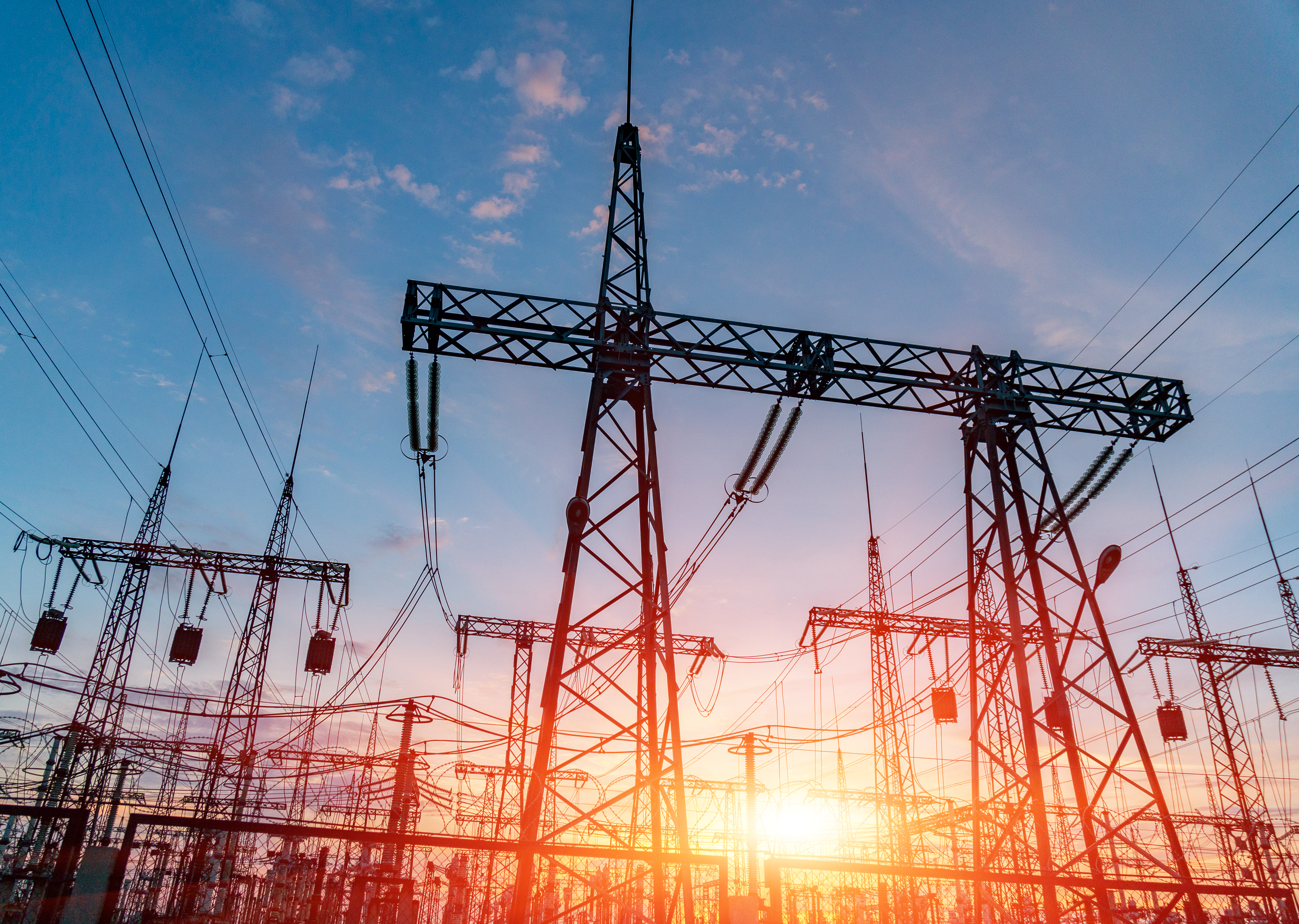 High-voltage power lines. Electricity distribution station. high voltage electric transmission tower. Distribution electric substation with power lines and transformers