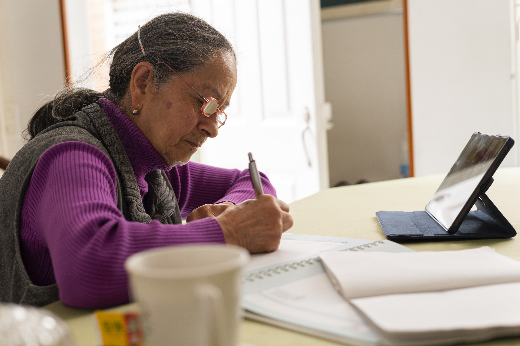 Latina woman over the average age of 64 studies virtually