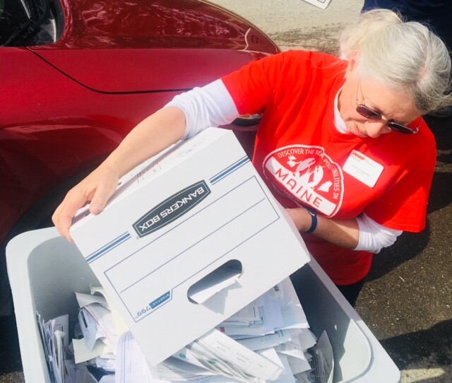 Volunteer Emptying a Bin Bangor