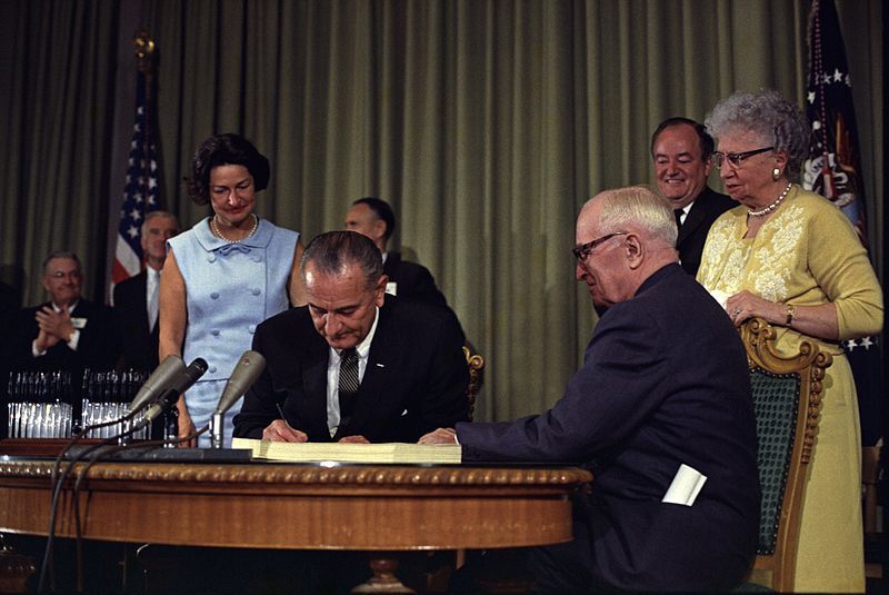 LBJ signs Medicare into law