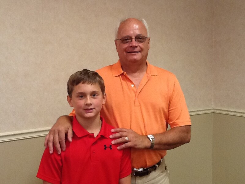 Isaac with grandpa Dennis Bartsch of Bismarck-subject of Isaac's essay