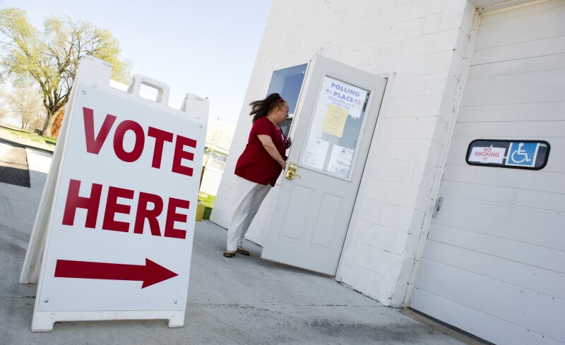A Voter enters the fire station polling