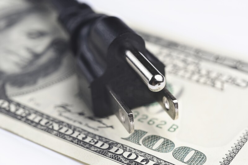 power cord over us dollar bills