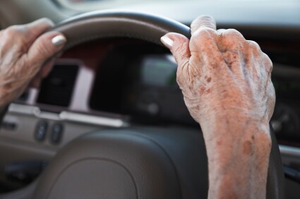 senior woman driving car