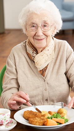 Senior Woman Enjoying Meal