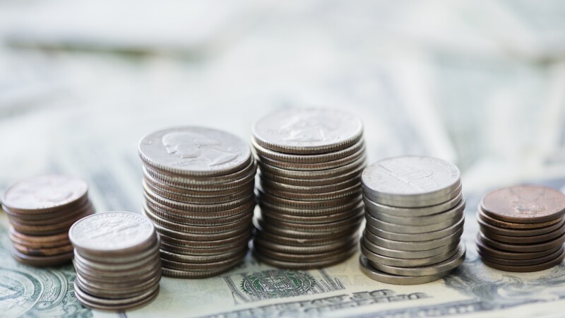 Close up of stacks of coins and money