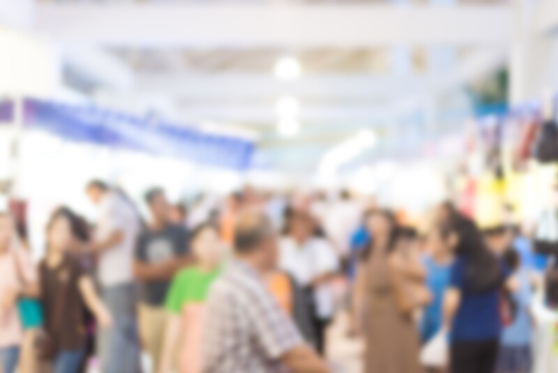 blurred image of exhibition show market product and crowd people