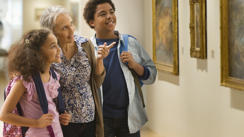 Grandmother and grandchildren visiting a museum