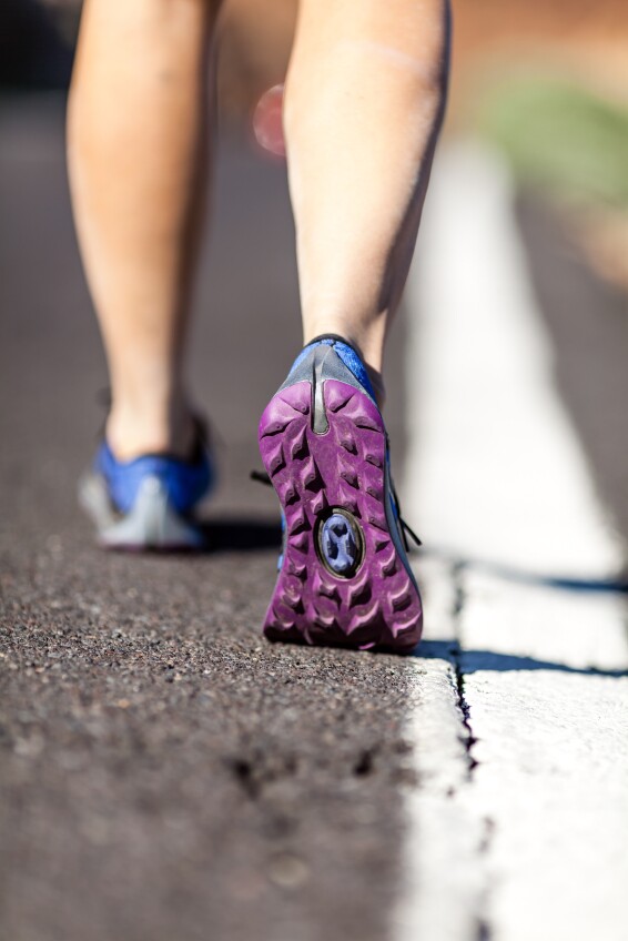 Walking or running legs in forest, adventure and exercising