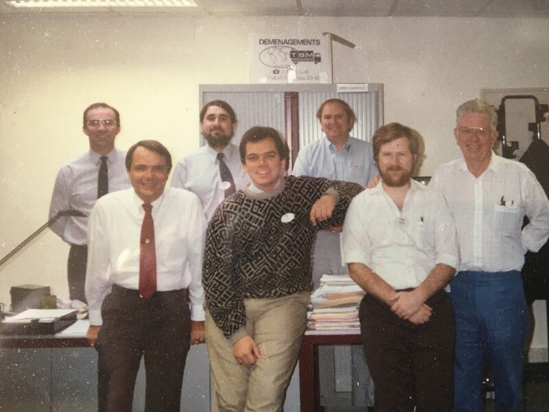 Seven men posing for a group photo