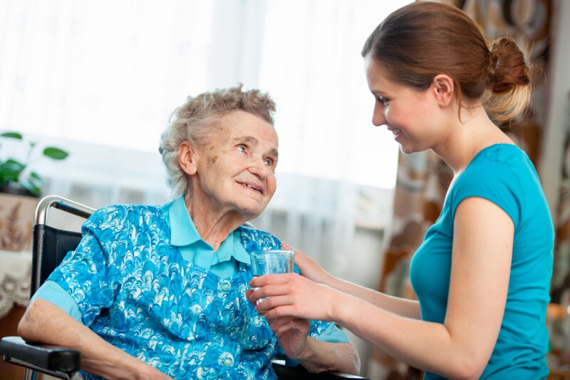 Care assistant helping an elderly patient