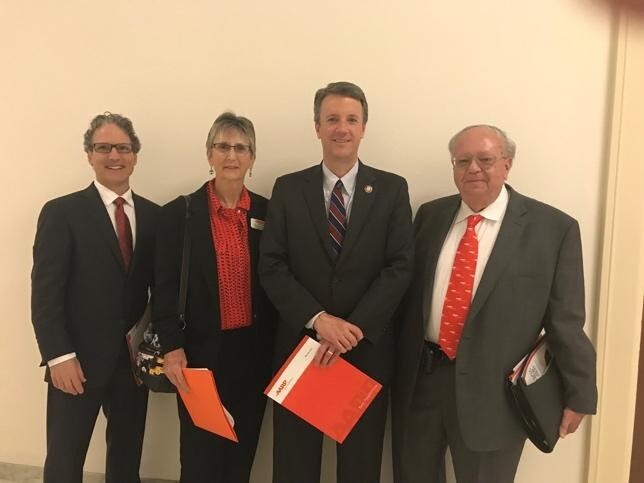 Suzanne with Cline and volunteers.jpg