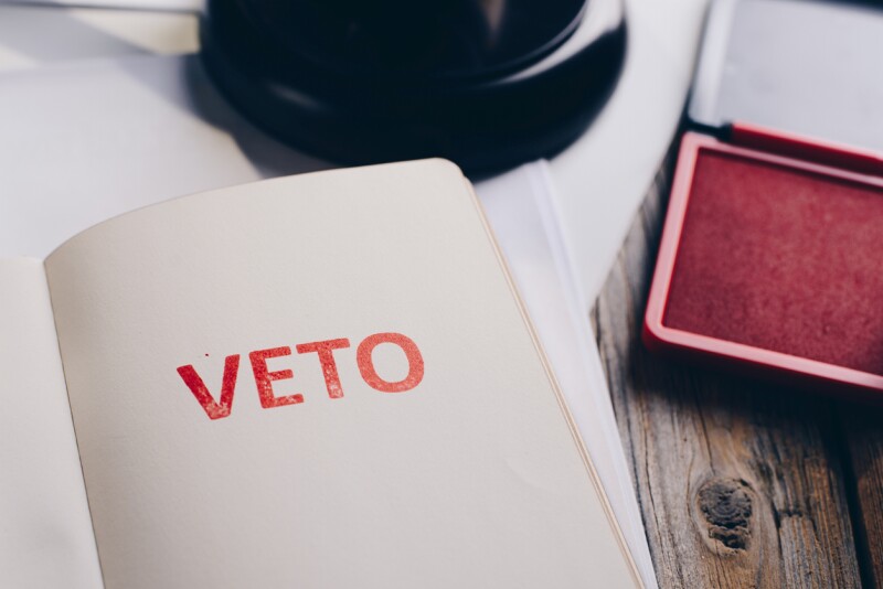 Red veto stamp in notepad