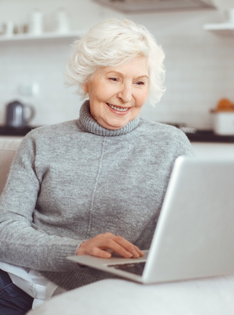 Grandma learns how to work with a computer at home