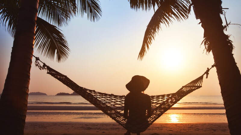 silhouette of woman in hat