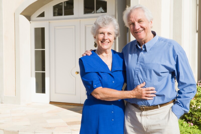 Home Fit couple in front of home iStock_000008533204Small. monkeybusinessimages