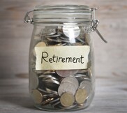 Money jar with retirement label.