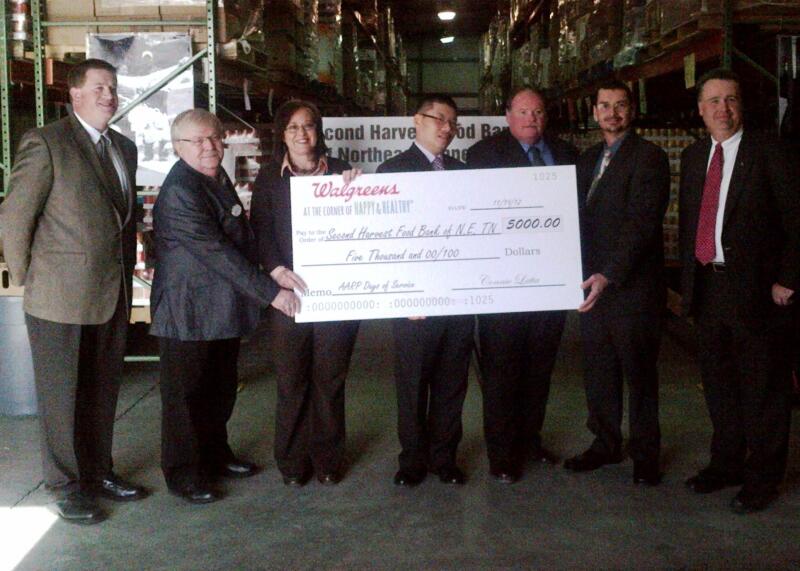 AARP volunteer leader Buster Watts and Walgreens executives with Rhonda Chafin of the Second Harvest Food Bank of Northeast Tennessee