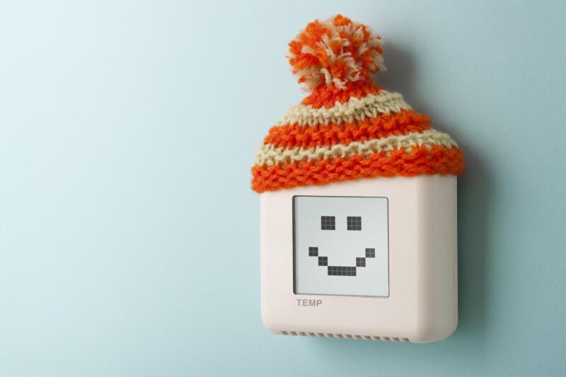 Digital room temperature thermostat with smiley face and wooly h