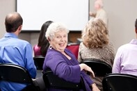 Real People: Senior Adult Business Woman Presentation Small Group