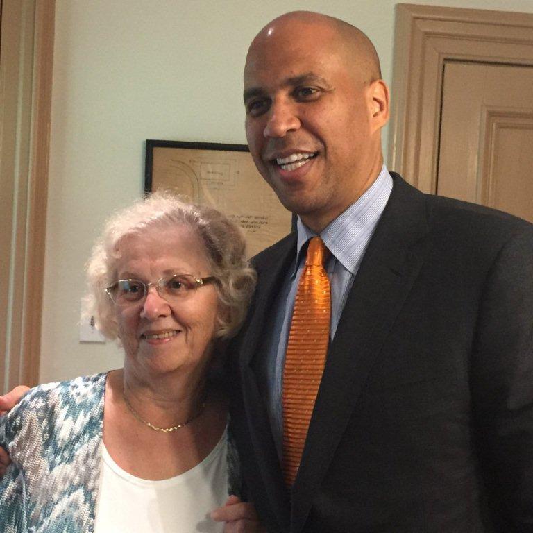 Lilyan Cralle standing with Senator Booker in August 2016.