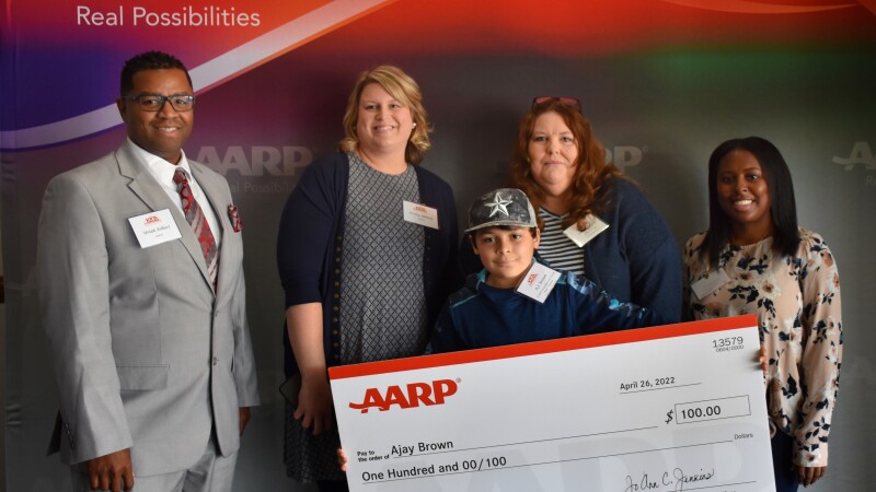 Essay winner family with Teacher and Principal