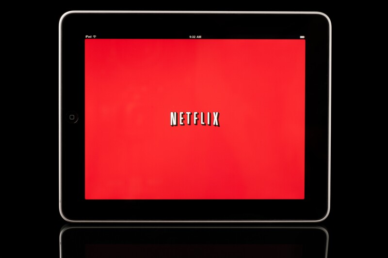 Apple iPad displaying Netflix app, Black with Reflection
