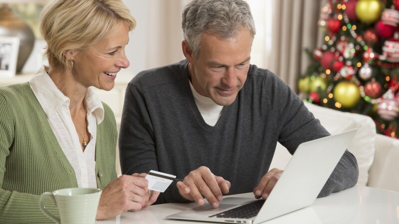 Couple shopping on laptop
