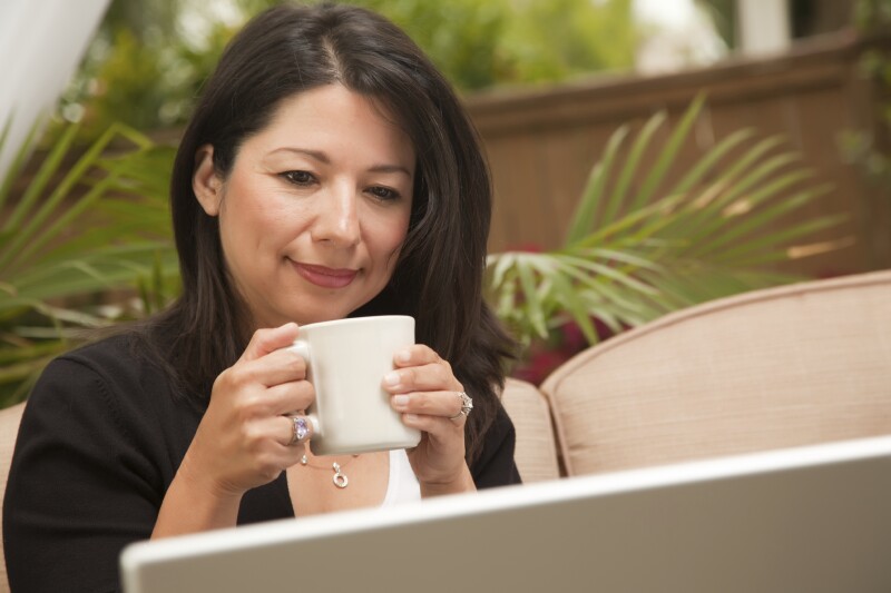 Woman looking at laptop