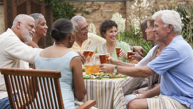 Friends having dinner party on patio