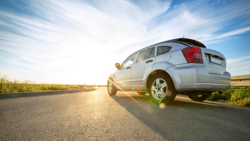 car on road over sunny day