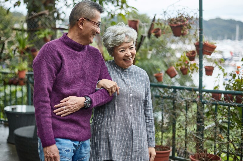 Happy affectionate senior couple walking together