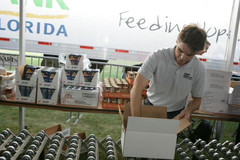 Jeff Gordon packing food box Feb 2013
