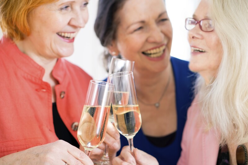 Happy Moms Celebrating Something with Wine. Close up.