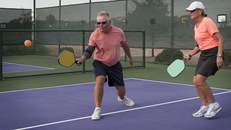 Mixed Doubles Pickleball Action - Smooth Backhand